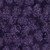 Lumin Fabrics Island Batik Sunflower Spice Batiks Pinecones and Fir Sprigs Purple, purple batik fabric with distressed sunflower, pinecone, and fir sprig patterns.