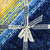Lumin Fabrics Island Batik Countryside Charm Batiks 10 Inch Squares, a bundle of vibrant blue and yellow batik fabric squares with floral and abstract patterns, tied with a white ribbon labeled 'Island Batik'.