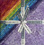 Lumin Fabrics Island Batik Sunflower Spice Batiks 10 Inch Squares, a colorful array of fabric squares with sunflower and spice patterns, tied with a white ribbon labeled 'Island Batik'.