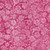 Lumin Fabrics Island Batik Posy Twist Batiks Small Flowers and Leaves Pink Camelia, pink fabric with a floral pattern of small flowers and leaves.