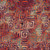 Lumin Fabrics Island Batik Salsa Batiks Circle Maze Multi Red Blue Dusty, colorful fabric with a circular maze pattern and geometric design in shades of red, blue, purple, and dusty tones.
