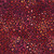 Lumin Fabrics Island Batik Salsa Batiks Petal Flower Red Redwood, fabric with a vibrant floral pattern featuring petal and flower shapes in red, pink, purple, and orange hues.