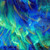 Timeless Treasures Fabrics Endless Sky Gilded Northern Light Met Aurora Blue, abstract fabric design with vibrant shades of blue, green, and gold speckles, resembling a celestial sky or aurora borealis.