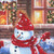 Timeless Treasures Fabrics Christmas Eve Dona Gelsinger Holiday Dream House Snowman Cat Dog Multi, detailed festive winter scene with a snowman wearing a red knitted scarf and hat, decorated Christmas tree, cozy fireplace, and winter window with icicles.