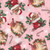 Timeless Treasures Fabrics Christmas Favorites Cats in Stockings Pink, festive fabric pattern featuring adorable cats wearing Santa hats inside red Christmas stockings decorated with holly leaves and berries on a pink background.