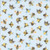 Dear Stella Fabrics Sting Like a Bee Sky Blue Busy Bees fabric, printed with colorful bees and floral elements on a light blue background.