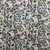 FreeSpirit Fabrics Graywork Minky Fleece by Tula Pink Beauty Mark Fog, fabric design featuring floral and leopard patterns in black and white with colorful accents and gray background.