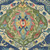 Covington Fabrics Falkor Dream Blue Happy Dragon Medallions, close-up view of a vibrant blue fabric with intricate colorful medallion and floral patterns.