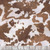 Timeless Treasures Fabrics Home On The Range Pony Ponyskin Fur, close-up of brown and white cowhide pattern fabric.