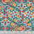Benartex Fabrics Farm Feathered Folk Nicole Decamp Folklore Garden Sky Blue, colorful floral fabric with yellow, red, and orange flowers on a light blue background.