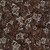 Timeless Treasures Fabrics Apple Basket Tonga Batiks Falling Leaves Umber, fabric with a dark brown background featuring white leaf patterns and falling leaves design.