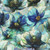 Hoffman Fabrics Flourish Poppies Floral Seamist Green, vibrant floral fabric with large blue and white poppy flowers accented with golden lines and details.
