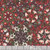 In The Beginning Fabrics Winter Enchantment by Jason Yenter Red Kaleidoscope, detailed pattern of Christmas-themed floral and geometric designs in red, white, green, and black colors.