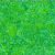 Hoffman Fabrics Bali Hand Dyed Batik Droplets Grass Green, vibrant green batik fabric with a droplet pattern.