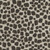 Henry Glass Fabrics Jungle Romp Betsey Cavallo Cream Beige Giraffe Skin fabric, animal print design with black and beige irregular spots resembling giraffe skin.