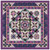 Timeless Treasures Fabrics Chateau Tonga Batiks Chateau Queen Quilt Kit, intricate quilt featuring a vibrant purple border with detailed geometric patterns and floral motifs in various shades of purple, pink, green, and cream.