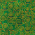 Robert Kaufman Fabrics Gustav Klimt Tree of Life Boughs Green, a fabric with intricate gold spiral patterns and stylized tree motifs on a vibrant green background.
