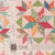 Riley Blake Fabrics Double Lush Velvet Lori Holt Farmers Daughter Quilt Blocks, a colorful patchwork quilt fabric display with various floral and geometric patterns in pink, green, orange, blue, and gray colors.