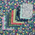 Dear Stella Designs Aloha 12 Fat Quarters, colorful array of fabric cuts with tropical and floral patterns laid out on matching floral background.