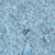 Lumin Fabrics Island Batik Cherry Blossom Vine Swirl Blue Bluebelle, intricately patterned fabric with swirling cherry blossom vine motifs in shades of blue on a textured gray background.