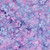 Lumin Fabrics Island Batik Garden Bloom Floral Drift Multi Purple Pink Iris, floral and abstract batik pattern in pastel purple, pink, and blue shades.