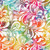 Lumin Fabrics Island Batik Paisley Pop Large Paisley Swirl Multi Yellow Pink Blue Jellybean, colorful batik fabric with large paisley swirl patterns in yellow, pink, blue, green, and orange hues.