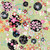 In The Beginning Fabrics Alice Garden of Flowers, colorful floral pattern with various flowers, circles, and whimsical designs on a light green background.