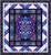 Quilting Treasures Fabrics Royale Dan Morris Flying Carpet Quilt Kit, intricate stained glass style design featuring vibrant blue, purple, and gold colors with floral and geometric patterns.
