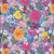 Windham Fabrics Midnight Blooms Floral Wildflower Pickings Sky Blue, vibrant floral fabric with colorful pink, yellow, orange, white, purple, and blue flowers on a sky blue background.