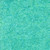 Timeless Treasures Fabrics Tonga Batiks Mermaid Dotty Spiral Paradise, close-up of a vibrant turquoise batik fabric featuring a pattern of white dots arranged in spiral and swirl designs.