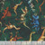 Quilting Treasures Fabrics Savage Kingdom Dan Morris Forest Green Dinosaurs, fabric with colorful dinosaur illustrations on a green background.
