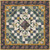 Moda Fabrics Chelsea Garden Treasure Trove Midnight Quilt Kit, a detailed quilt featuring a central paisley pattern surrounded by geometric and floral fabric designs, with a decorative border in shades of blue, gold, and pink.