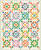 Moda Fabrics Ruby Star Society Melody Miller Scenic Waypoint Quilt Kit, colorful patchwork quilt featuring star patterns on a pink dotted background.