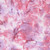 Moda Fabrics Mermaid Batiks Moda Starfish Pink, watercolor-inspired fabric with pink, purple, and white hues and abstract mermaid and starfish patterns.