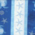 Lumin Fabrics White Owl Textiles Take Me To The Sea Blue Sea Turtles Starfish Repeating Stripe, beach-themed fabric with starfish, sea turtles, shells, and coral in shades of blue and white.