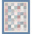 Windham Fabrics Tapestry Wholecloth Quilt Kit, decorative patchwork quilt with pink, red, blue, and floral patterns framed by a blue border with small gold accents.