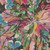Moda Fabrics Northern Brights Amarilys Henderson Watercolor Sage Brush Night Sky Black, vibrant colorful watercolor floral pattern fabric with hues of pink, purple, yellow, green, and blue on a black background.