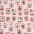 Riley Blake Fabrics Claus and Co Melissa Mortenson Wallpaper Pink, holiday-themed fabric featuring festive illustrations of reindeer, elves, Santa Claus, and holiday decorations on a pink background.