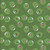 Riley Blake Fabrics Claus and Co Melissa Mortenson Ornaments Green, festive fabric with Christmas ornaments featuring pink and green characters on a green background with snowflake details.