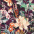 Robert Kaufman Fabrics Cider Blossom Wine Red Floral, vibrant fabric with a floral pattern featuring large and small flowers, leaves, and botanical elements in wine red, blush pink, peach, green, and hints of blue on a deep wine red background.