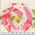 Henry Glass Fabrics Bloomscape Jane Shasky Pink Multi Cheater Quilt Print, colorful floral and geometric quilt pattern with various pink, yellow, green, and white fabrics.