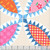 Windham Fabrics Made Easy Denyse Schmidt Cheater Quilt Pearl Cream Tobacco Leaf, colorful quilt fabric with floral, checkered, and geometric patterns.