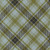 Moda Fabrics Chilly Sweetwater Christmas Plaid Aqua, close-up of green, black, and white plaid fabric with Christmas-themed pattern.