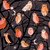 Moda Fabrics Freaky Familiars Ruby Star Society Who Cooks for You Eggplant Purple Brown Fabric with owls, owls perched on black tree branches, moon, and stars in various shades of pink, orange, and white.