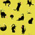 Moda Fabrics Freaky Familiars Ruby Star Society Catwalk Citron Yellow fabric with playful black cat illustrations and colorful star and moon accents.