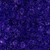 Timeless Treasures Fabrics Tonga Batiks Lilypad Rose Swirl Violet Purple, a vibrant purple fabric with a swirling rose pattern in various shades of violet.