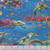 Timeless Treasures Fabrics Underwater Paradise Sea Life Sea Blue, vibrant fabric featuring colorful sea turtles, coral reefs, and various tropical fish in an underwater scene.