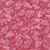 Windham Fabrics Anthology Batiks Jacqueline de Jonge Wonderful Feeling Fuchsia Pink Pine Leaves, vibrant pink fabric with pink pine leaf patterns and white dots.