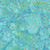 Windham Fabrics Anthology Batiks Jacqueline de Jonge Wonderful Feeling Bright Lights Twinkle, fabric with a watercolor background in shades of blue and green, decorated with scattered metallic and pastel-colored dots.