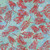 Windham Fabrics Anthology Batiks Jacqueline de Jonge Wonderful Feeling Misty Blue Pine Leaves, fabric with red pine leaves and silver accents on a misty blue and green watercolor background.